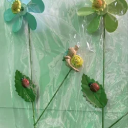 plastic flowers and ladybugs on a plastic wrap